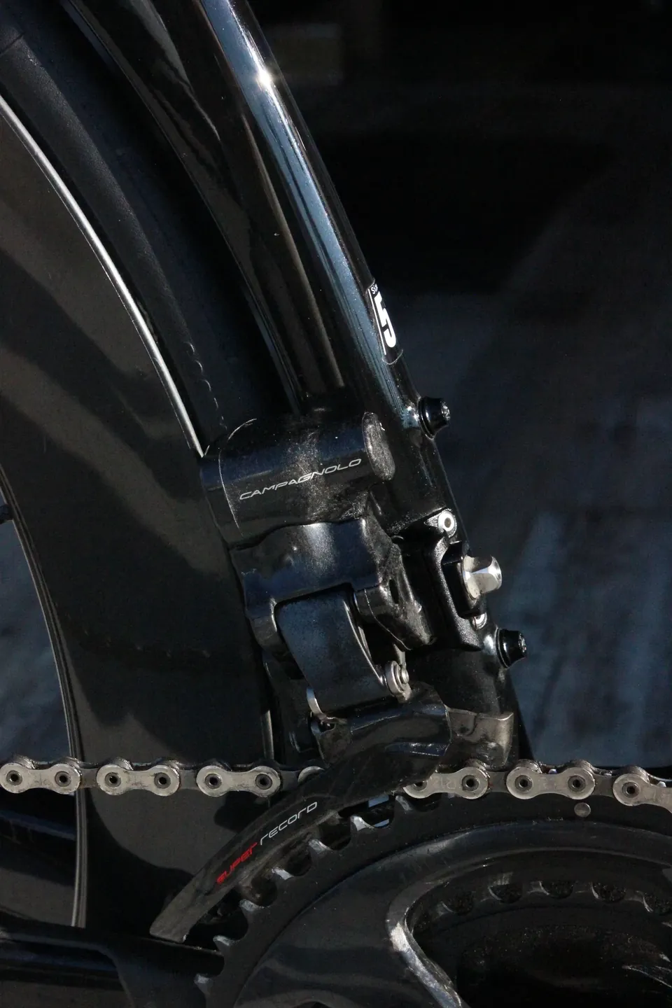 Close-up of a road bike chainring and chain