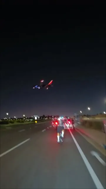 Riders with tail lights on heading home after an evening ride